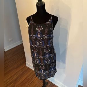 Size S beaded Francesca‘s cut out back sheath dress. Hits a bit above mid-thigh.